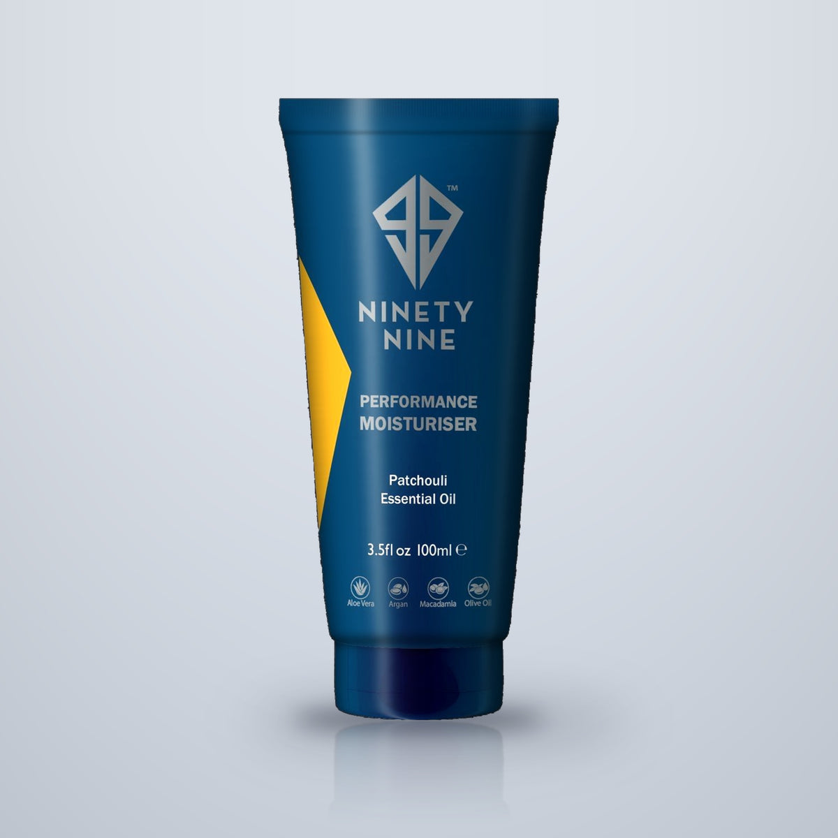 A 100ml squeeze tube of Ninety Nine Performance Moisturiser with Patchouli Essential Oil, featuring a dark blue design with a yellow accent stripe and silver branding, set against a light gray background.